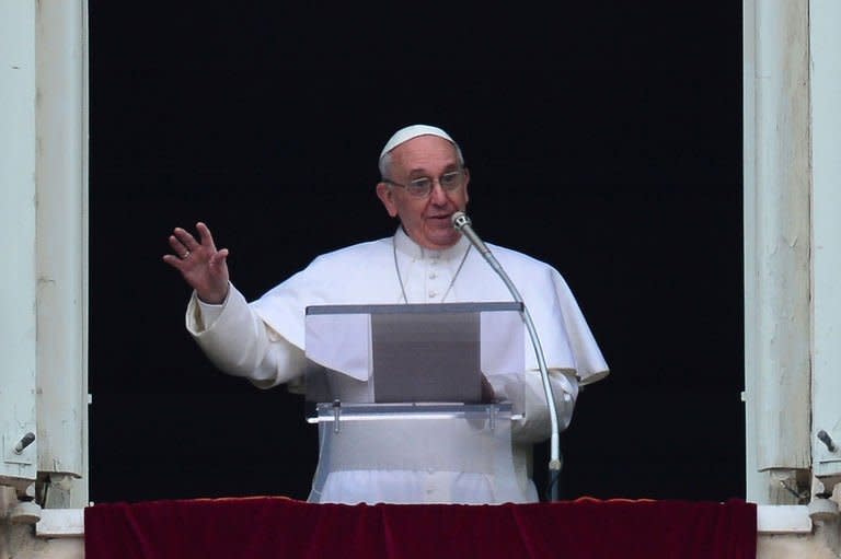 Pope Francis leads his first Angelus prayer from the window of the apartments at St Peter's Square on March 17, 2013