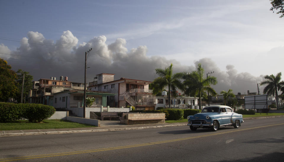 Smoke rises from a deadly fire at a large oil storage facility in Matanzas, Cuba, Tuesday, Aug. 9, 2022. The fire was triggered by lighting that struck one of the facility’s eight tanks late Friday, Aug. 5th. (AP Photo/Ismael Francisco)