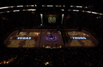 <p>The names of the 58 victims are projected on the ice during the 58 seconds of silence before the game. (Ethan Miller/Getty Images) </p>