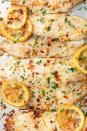 <p>High-protein tilapia has a very mild flavor and is a great way to lure in non-fish eaters. We cook ours in plenty of butter, lemon, and garlic—a combo everyone can enjoy. Baking is quick and easy, plus it eliminates any chance of the fish annoyingly sticking to a skillet or grill. Win-win!</p><p>Get the <strong><a href="https://www.delish.com/cooking/recipe-ideas/a19665918/oven-baked-tilapia-recipe/" rel="nofollow noopener" target="_blank" data-ylk="slk:Garlicky Lemon Baked Tilapia recipe;elm:context_link;itc:0" class="link ">Garlicky Lemon Baked Tilapia recipe</a>.</strong></p>