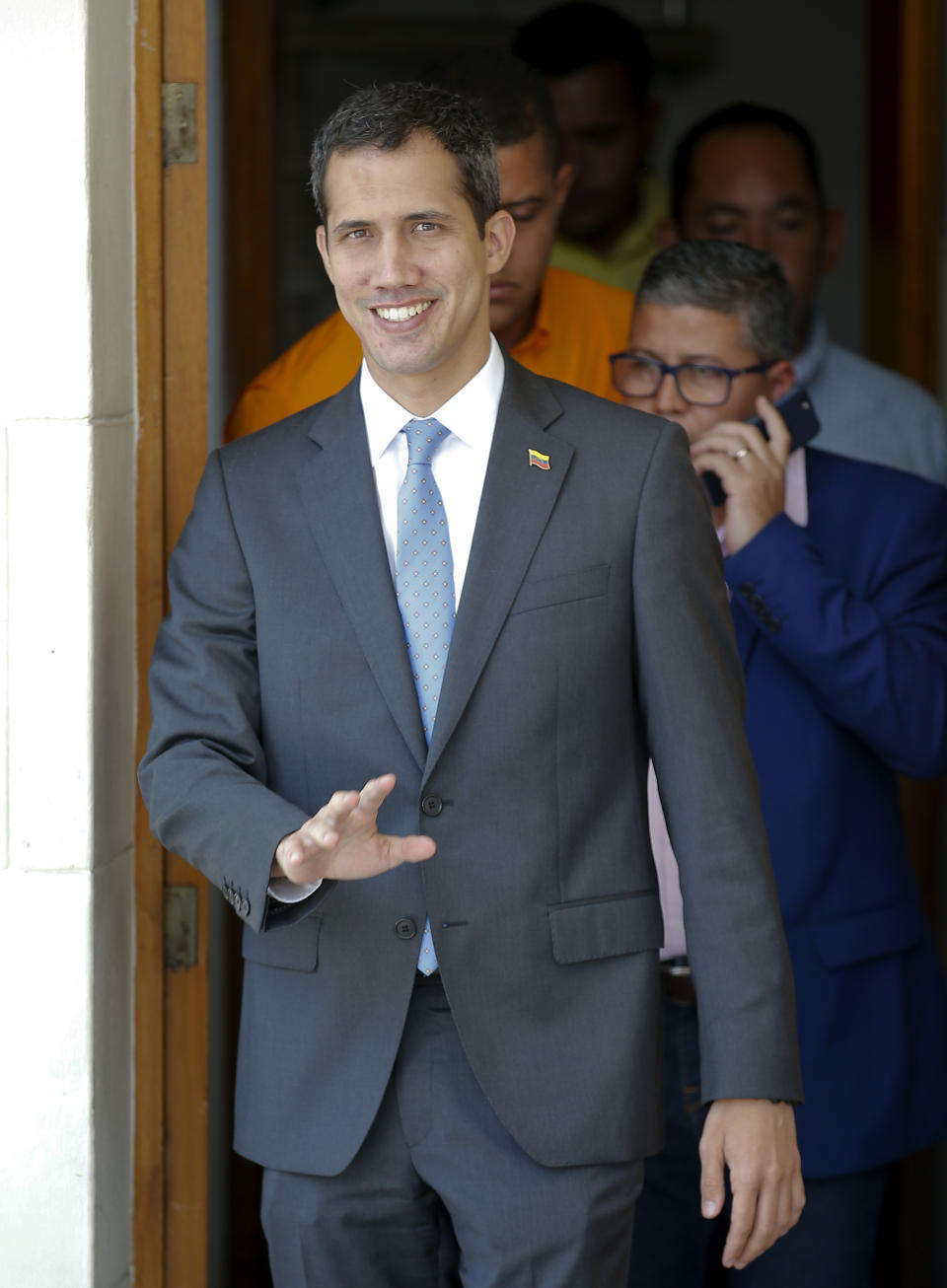 National Assembly President Juan Guaido, who declared himself interim president of Venezuela, arrives to lead a session of the opposition-controlled assembly in Caracas, Venezuela, Monday, March 11, 2019. An explosion rocked a power station Monday in the Venezuelan capital, witnesses said, adding to the crisis created by days of nationwide power cuts, while Guaido has blamed the blackouts that began Thursday on alleged government corruption and mismanagement. (AP Photo/Eduardo Verdugo)
