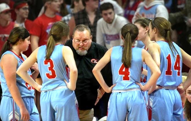 Lewistown High School girls basketball coach Greg Bennett confers with his players during the 2020 Class 1A state-championship game in Normal.