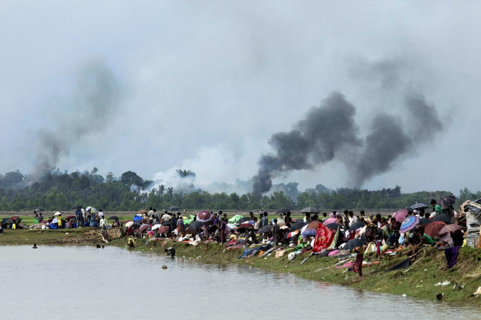 Smoke billows above what is believed to be a burning village in Myanmar's Rakhine state as members of the Rohingya Muslim minority take shelter in Ukhia, Bangladesh on Sept. 4, 2017.