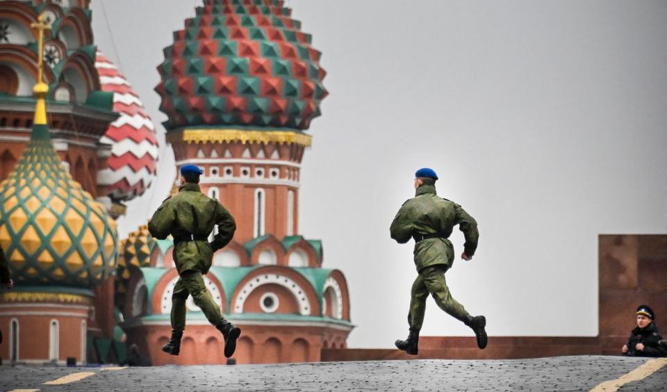 Russian soldiers run along Red Square in central Moscow as the square is sealed prior to a ceremony of the incorporation of the new territories into Russia (AFP via Getty Images)