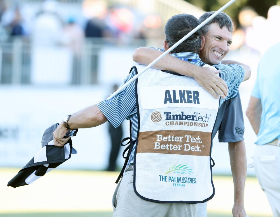 Steve Alker hugs his caddie, Sam Workman, after winning the TimberTech Championship Sunday at The Old Course at Broken Sound.