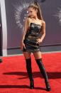 <p>Ariana Grande worked this skintight leather mini Moschino look at the 2014 awards show.</p>