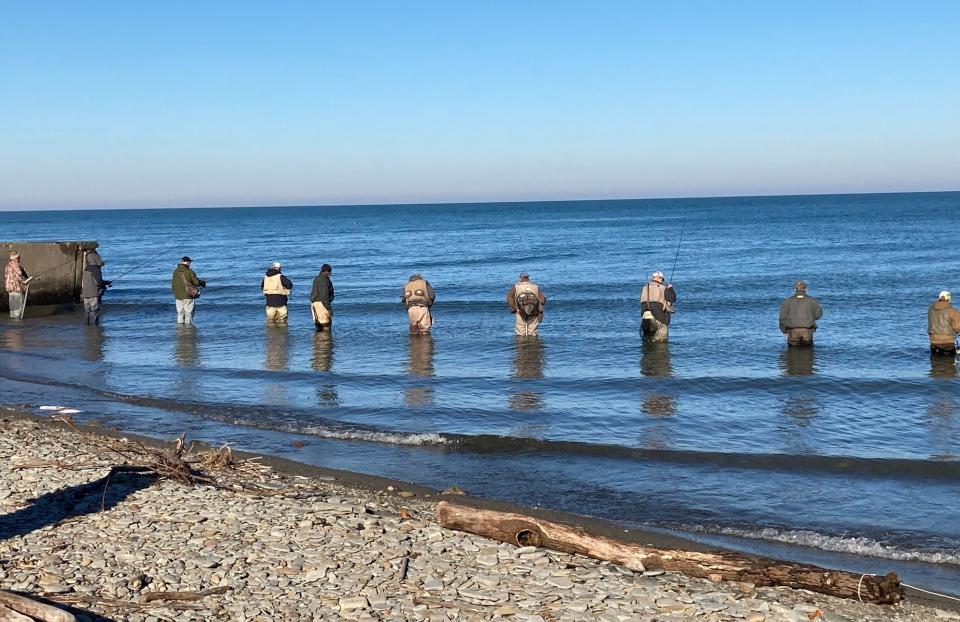 Steelhead anglers line up along the Lake Erie shoreline at Avonia Beach near Trout Run in Fairview Township in Erie County on Monday.