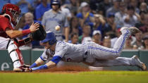 Toronto Blue Jays' Danny Jansen, right, beats the tag by Boston Red Sox catcher Reese McGuire to score on a single by Vladimir Guerrero Jr. during the fourth inning of a baseball game, Thursday, Aug. 25, 2022, in Boston. (AP Photo/Charles Krupa)