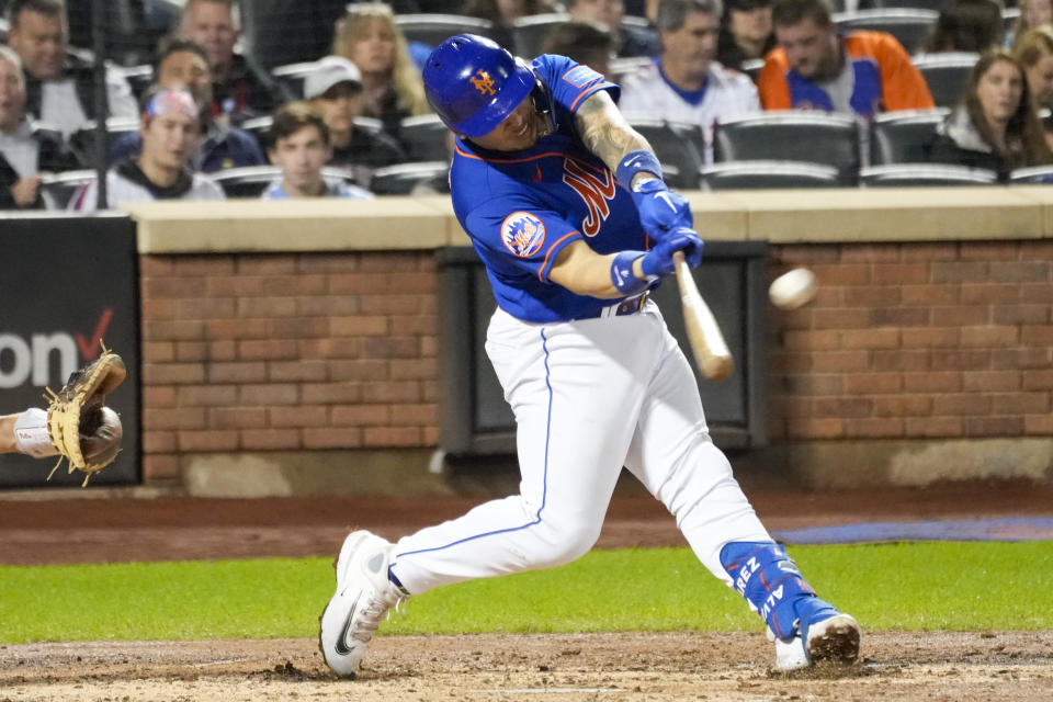 New York Mets' Francisco Alvarez hits a grand slam during the third inning of the second game of a baseball doubleheader against the Philadelphia Phillies, Saturday, Sept. 30, 2023, in New York. (AP Photo/Mary Altaffer)