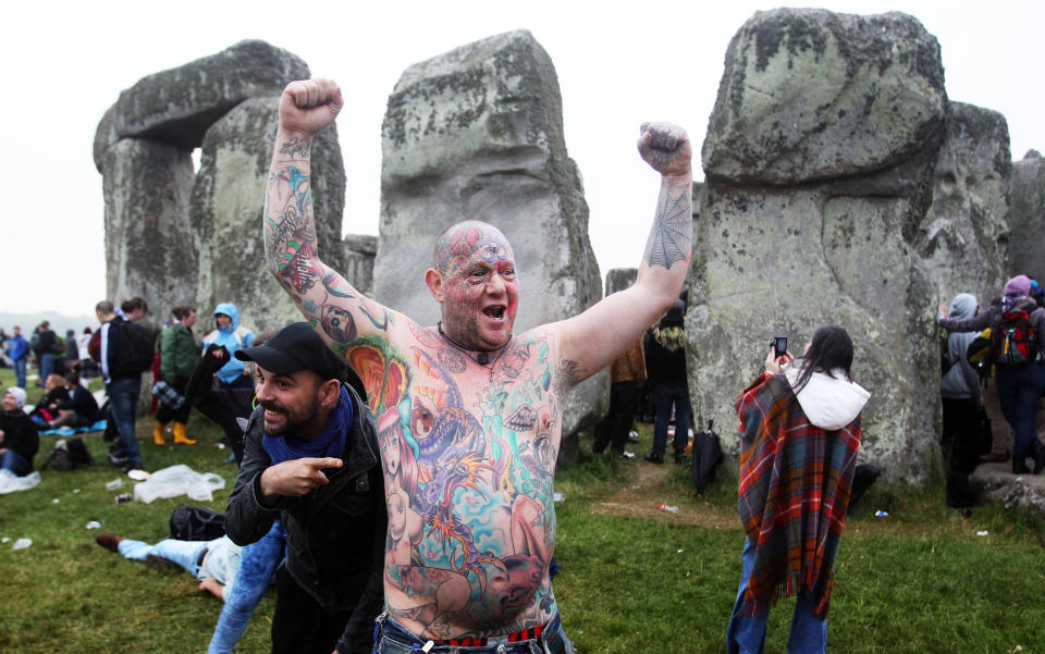 Crowds gather at dawn amongst the stones at Stonehenge in Wiltshire for the Summer Solstice.