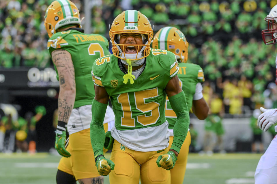 Oregon wide receiver Tez Johnson (15) celebrates after a long gain against Washington State during the first half of an NCAA college football game Saturday, Oct. 21, 2023, in Eugene, Ore. (AP Photo/Andy Nelson)