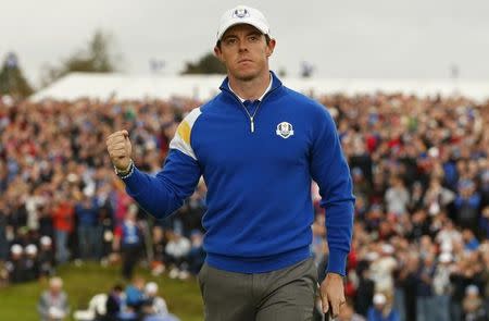 European Ryder Cup player Rory McIlroy celebrates going one up on the first hole during the 40th Ryder Cup singles matches at Gleneagles in Scotland September 28, 2014. REUTERS/Phil Noble
