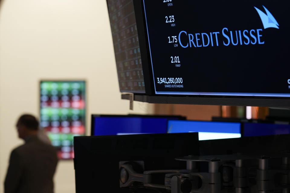 A sign displays the name of Credit Suisse on the floor at the New York Stock Exchange in New York, Wednesday, March 15, 2023. (AP Photo/Seth Wenig)