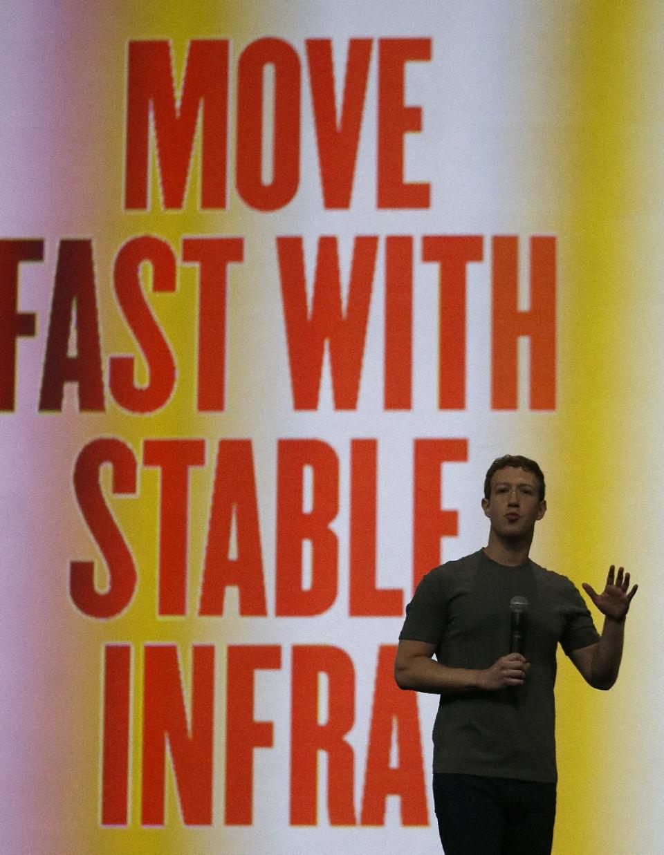 Facebook CEO Mark Zuckerberg gestures while delivering the keynote address at the f8 Facebook Developer Conference Wednesday, April 30, 2014, in San Francisco. (AP Photo/Ben Margot)