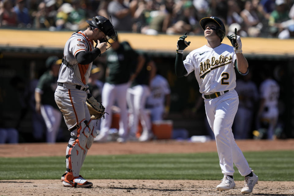 Oakland Athletics' Nick Allen, right, celebrates next to San Francisco Giants catcher Patrick Bailey after hitting a solo home run during the fifth inning of a baseball game Sunday, Aug. 6, 2023, in Oakland, Calif. (AP Photo/Godofredo A. Vásquez)