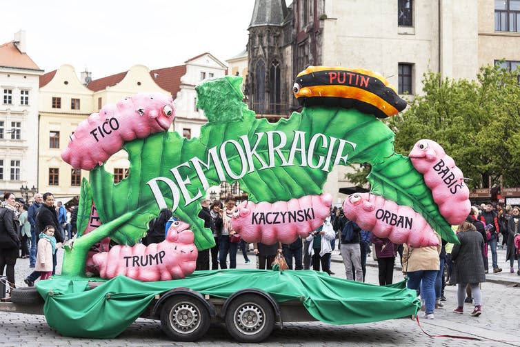 <span class="caption">A float in Prague’s Labour Day procession protests the degradation of Eastern European democracy.</span> <span class="attribution"><a class="link " href="https://www.shutterstock.com/image-photo/prague-czech-republic-maj-1-2017celebration-634592537?src=Ld9MwCd5ZKc3zCov9LlbwA-1-48" rel="nofollow noopener" target="_blank" data-ylk="slk:shutterstock;elm:context_link;itc:0;sec:content-canvas">shutterstock</a></span>