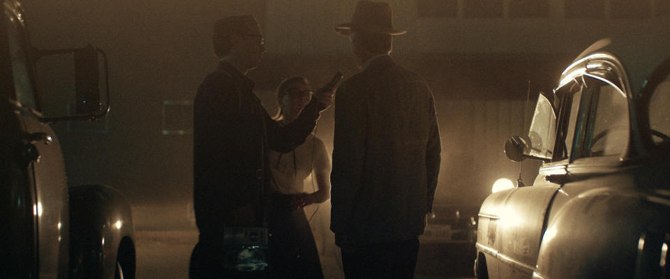 This image released by Amazon Studios shows Jake Horowitz, left, and Sierra McCormick, center, in a scene from "The Vast of Night." (Amazon Studios via AP)