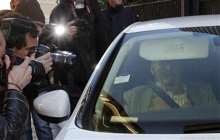 Jean-Claude Mas (R), founder of French company Poly Implant Prothese (PIP), leaves the Marseille's court December 10, 2013. REUTERS/Jean-Paul Pelissier