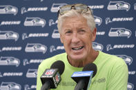 Seattle Seahawks head coach Pete Carroll talks with reporters after NFL football practice Wednesday, July 28, 2021, in Renton, Wash. (AP Photo/Ted S. Warren)