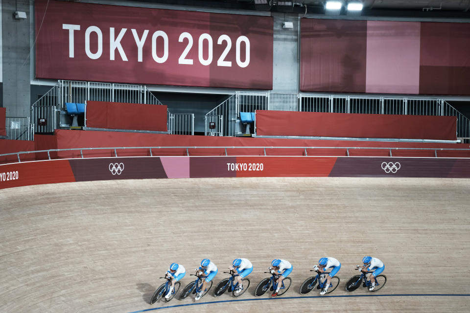 Members of the Italian women's track cycling team round the track during a training session inside the Izu velodrome at the 2020 Summer Olympics, Thursday, July 29, 2021, in Tokyo, Japan. (AP Photo/Thibault Camus)