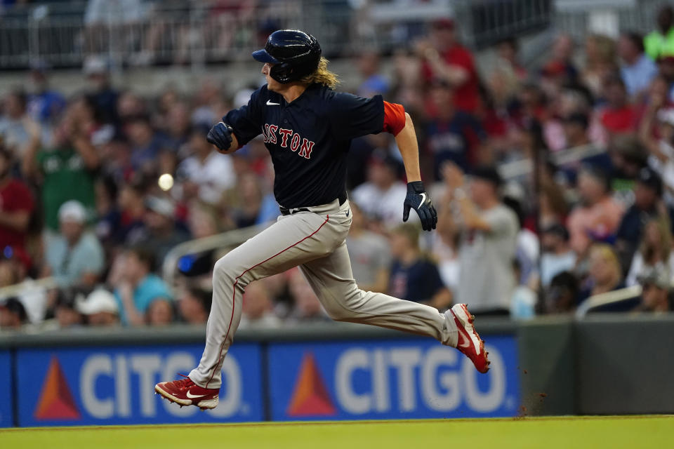 Boston Red Sox starting pitcher Garrett Richards runs to second base after driving in a run with a double in the fourth inning of a baseball game against the Atlanta Braves Wednesday, June 16, 2021, in Atlanta. (AP Photo/John Bazemore)