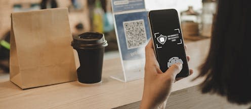 <span class="caption">Can technology empower consumers to make better decisions when they buy food?</span> <span class="attribution"><a class="link " href="https://www.shutterstock.com/image-photo/authentication-hand-customer-using-digital-mobile-2080027684" rel="nofollow noopener" target="_blank" data-ylk="slk:giggsy25/Shutterstock;elm:context_link;itc:0;sec:content-canvas">giggsy25/Shutterstock</a></span>