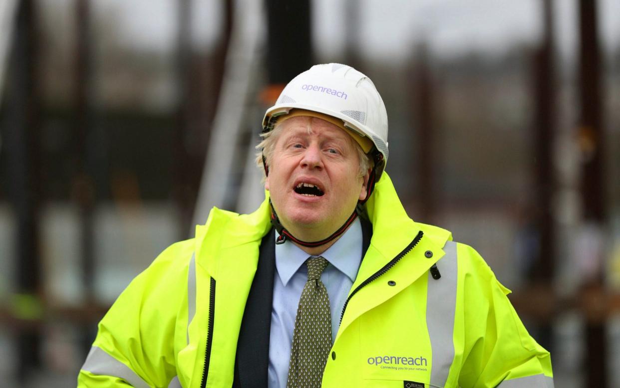 Britain's Prime Minister Boris Johnson reacts, during a visit to the Openreach - Peter Byrne/AP