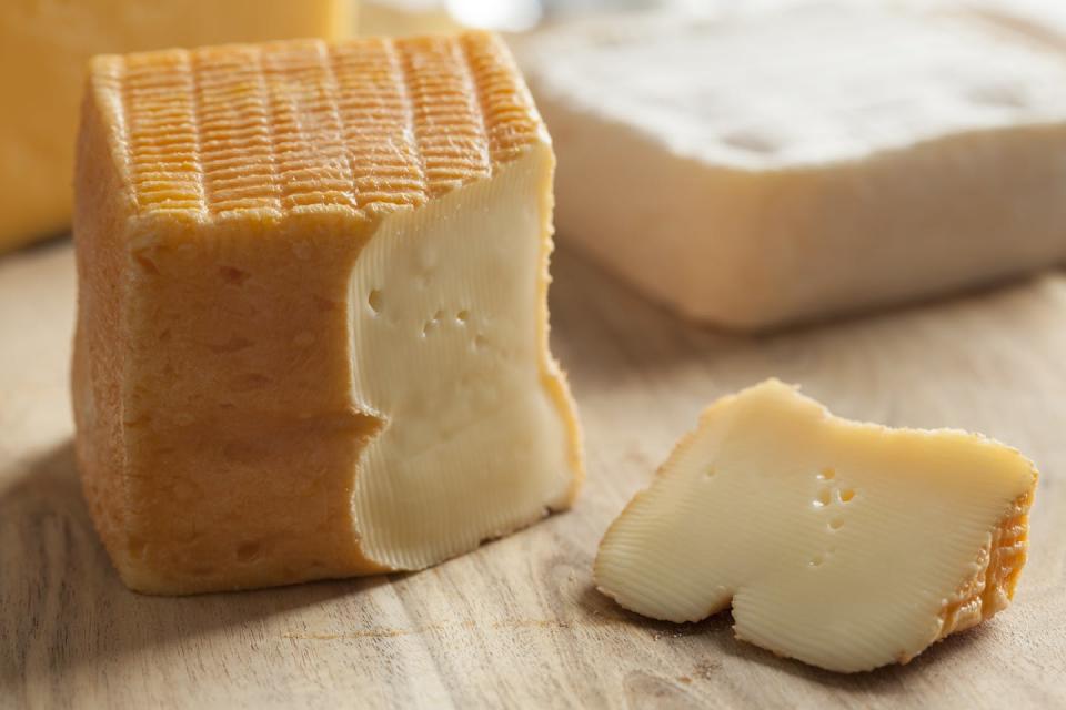 Bacteria contribute the stink of their waste to the overall odor of some cheeses as well. <a href="https://www.shutterstock.com/image-photo/piece-belgian-limburger-cheese-on-board-309618497" rel="nofollow noopener" target="_blank" data-ylk="slk:picturepartners/Shutterstock.com;elm:context_link;itc:0;sec:content-canvas" class="link ">picturepartners/Shutterstock.com</a>