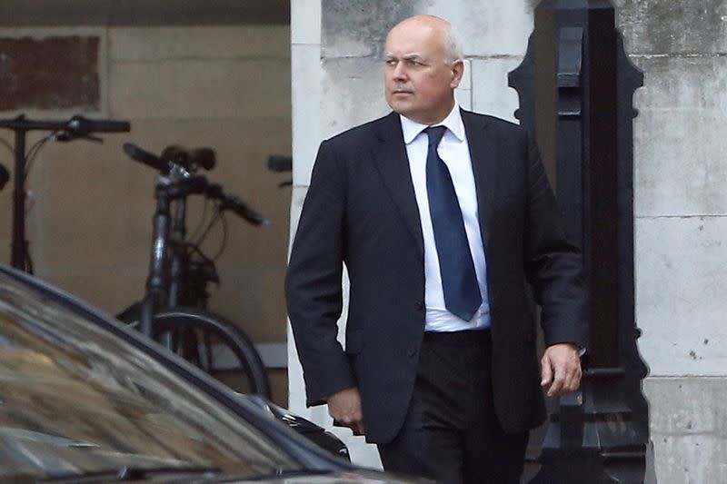 Britain's Conservative MP Iain Duncan Smith walks inside the Parliament grounds in London