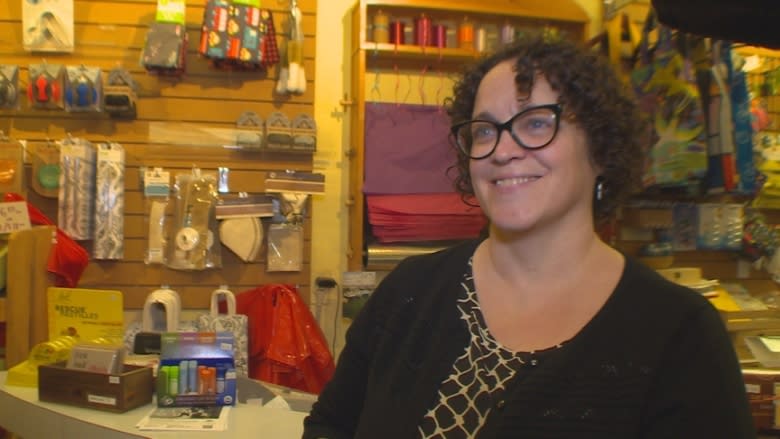 Smashed glass doesn't shatter shop owner's smile