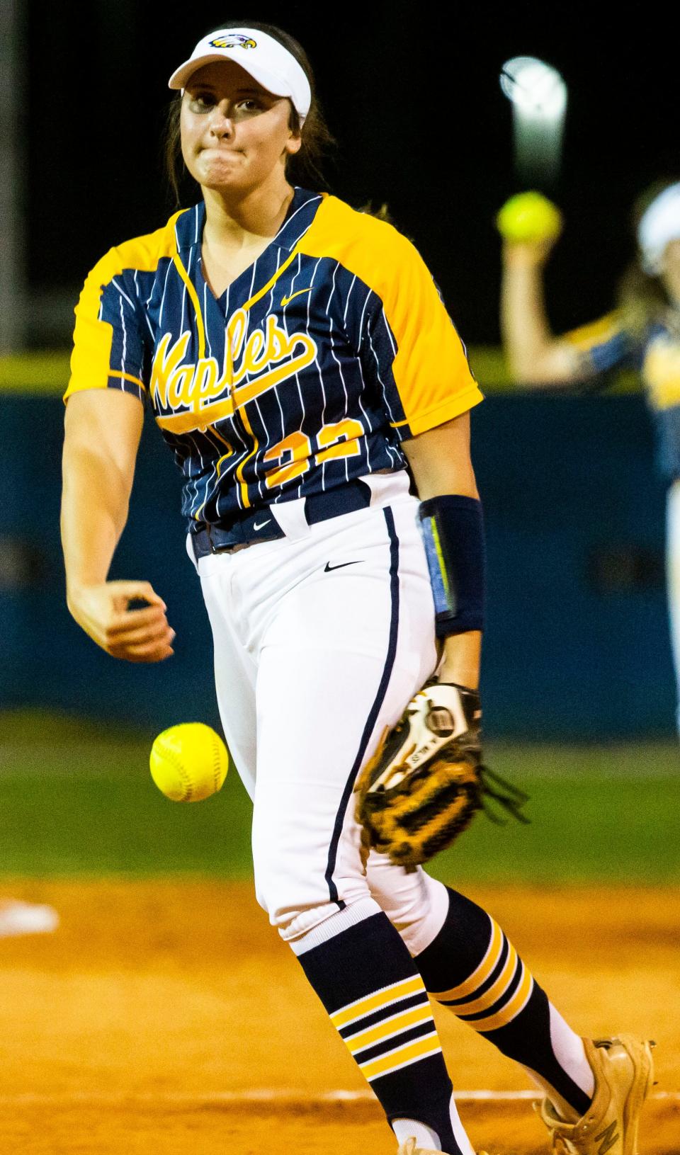 Naples' Macy Miles (22) pitches the ball during the Barron Collier and Naples softball game on Wednesday, Feb. 23, 2022 at Barron Collier High School in Naples, Fla. 