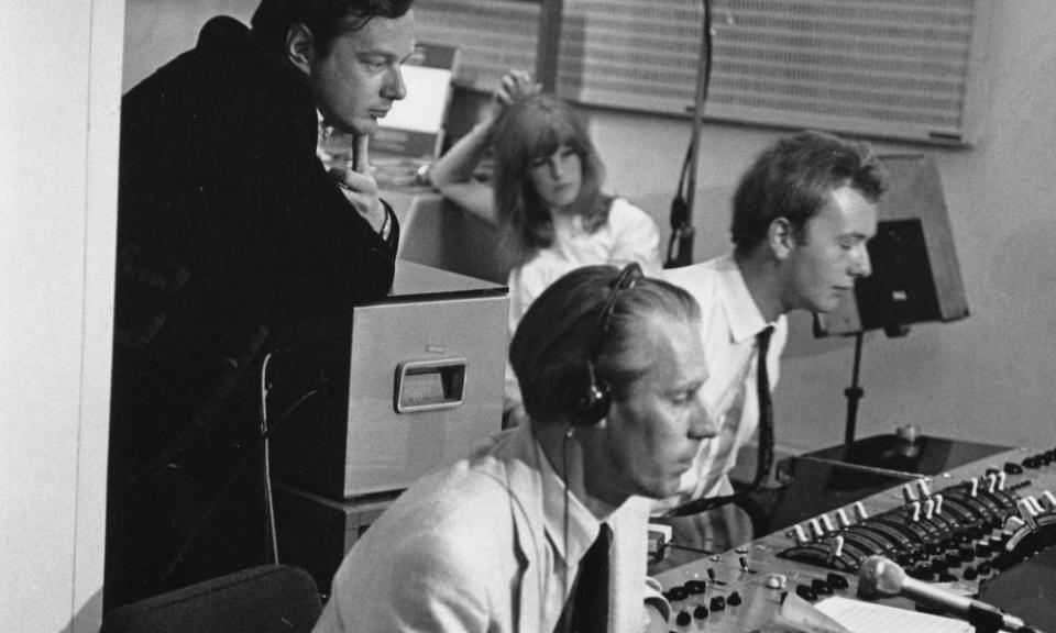 From left, Brian Epstein, George Martin and Geoff Emerick recording the Beatles at Abbey Road studios in 1967.