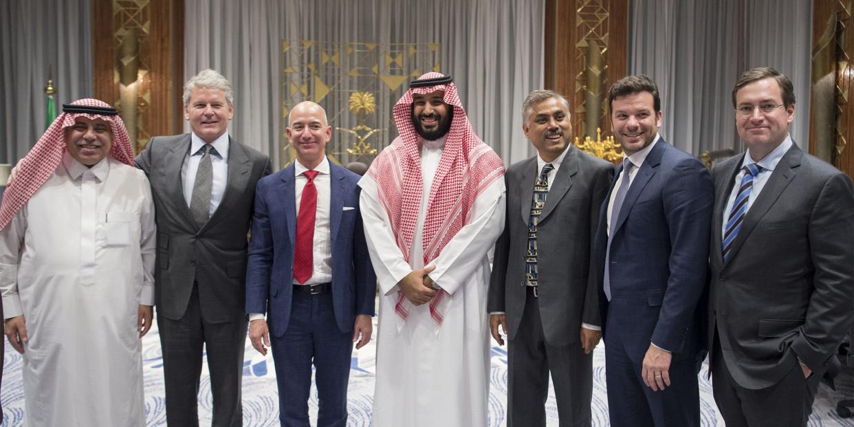 RIYADH, SAUDI ARABIA - NOVEMBER 9: Deputy crown prince of Saudi Arabia and Defense Minister Mohammad bin Salman Al Saud (C), the Minister of Trade and Investment of Saudi Arabia, Majed Bin Abdullah Al Kassabi (L) and founder of the Amazon website Jeff Bezos (3rd L) pose for a photo during his visit in in Riyadh, Saudi Arabia on November 9, 2016. (Photo by Pool / Bandar Algaloud/Anadolu Agency/Getty Images)