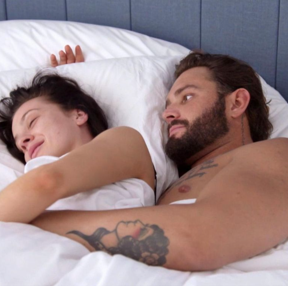 A still of Sam and Ines in bed from MAFS