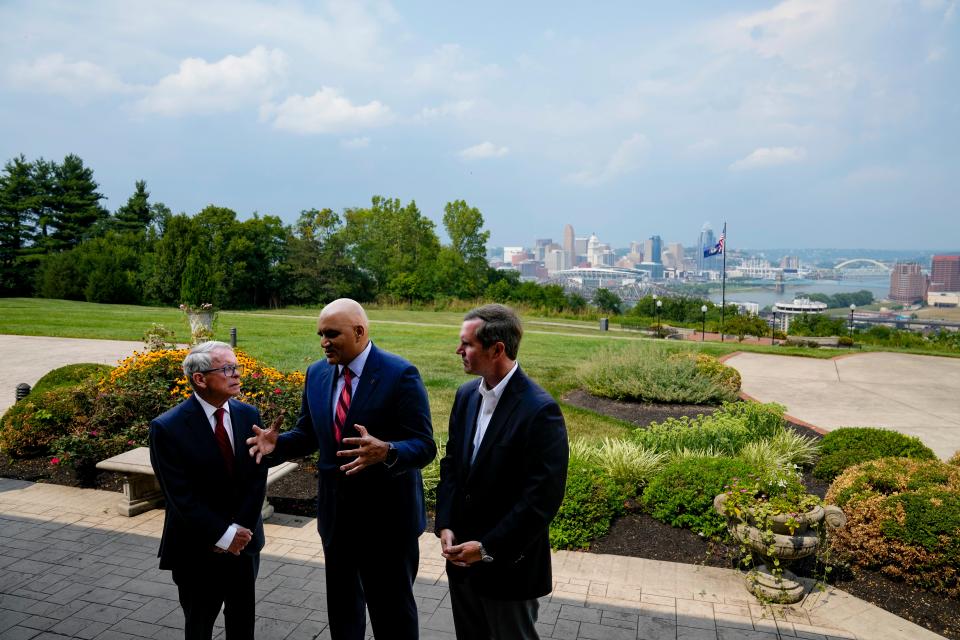 Ohio Gov. Mike DeWine, left, and Kentucky Gov. Andy Beshear, right, are champions for the Brent Spence Bridge Corridor Project. In July,  Federal Highway Administrator Shailen Bhatt joined them to announce the project's primary contractors.