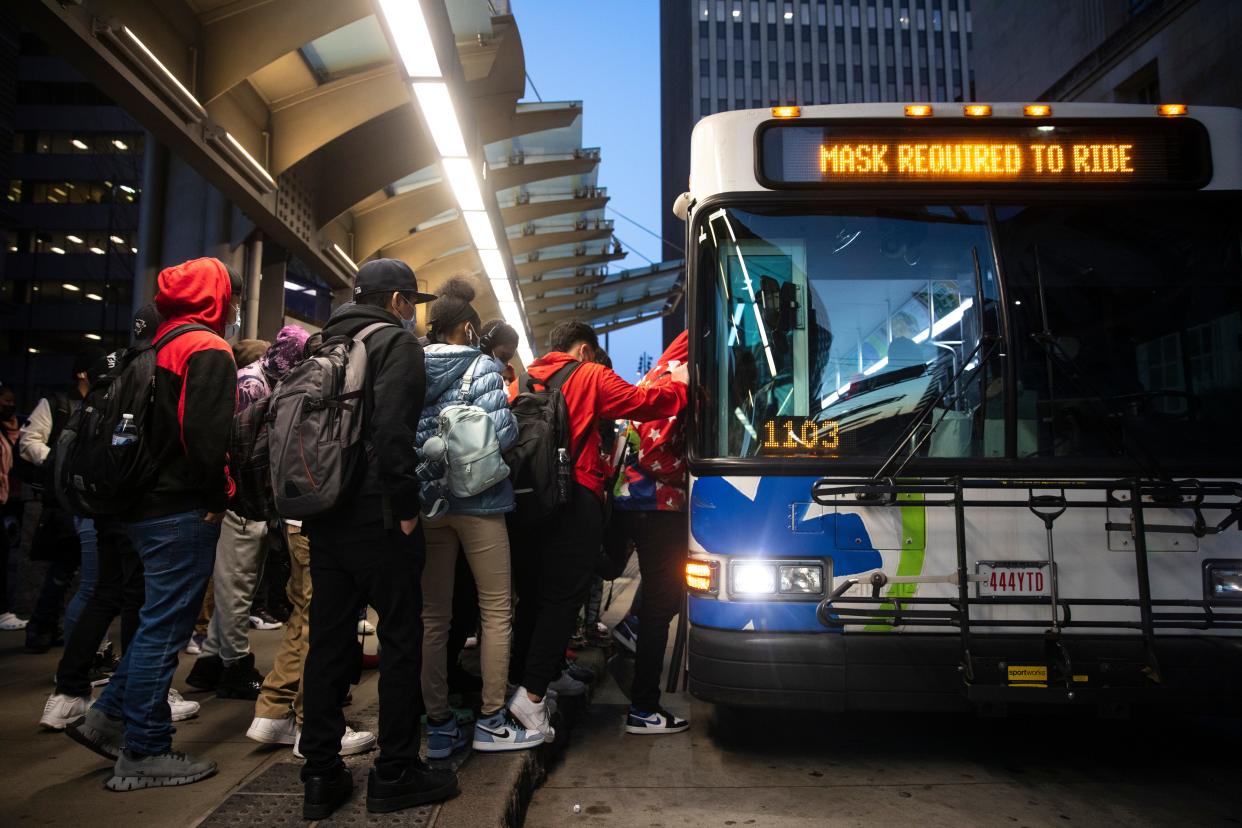 Passengers board a Metro at Government Square in 2022.