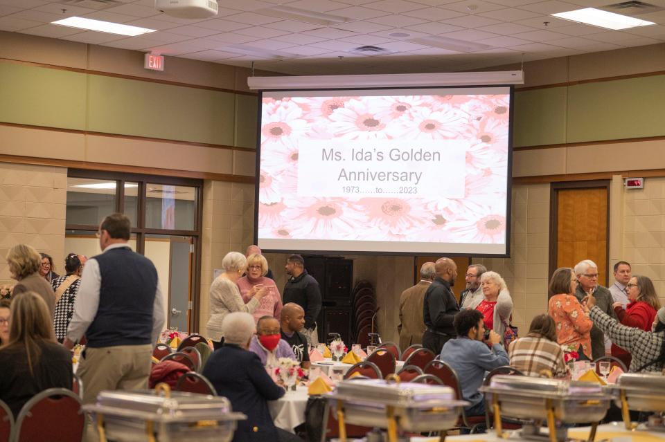 Guests arrive for the celebration of Ida McCray's 50-year teaching anniversary at Calhoun Area Career Center on Wednesday, Jan. 18, 2023.