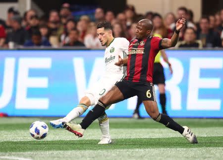 Dec 8, 2018; Atlanta, GA, USA; Portland Timbers midfielder Sebastian Blanco (10) battles for the ball with Atlanta United midfielder Darlington Nagbe (6) in the second half in the 2018 MLS Cup championship game at Mercedes-Benz Stadium. Mark J. Rebilas-USA TODAY Sports