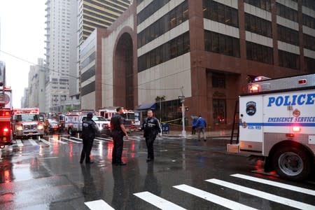 Emergency services first responders arrive at 787 7th Avenue in midtown Manhattan where helicopter crashed in New York