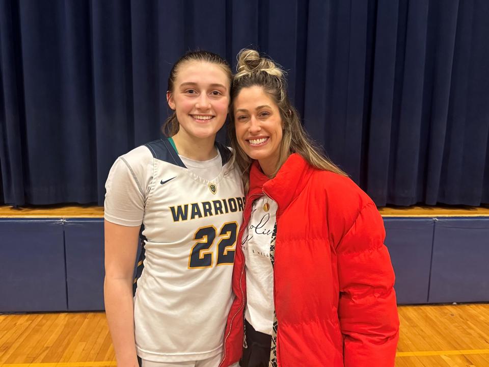 Simone Pelish, left, poses with former Lourdes girls basketball star Jenna Viani on Feb. 9, 2024. They are the only two in program history to eclipse 2,000 career points.