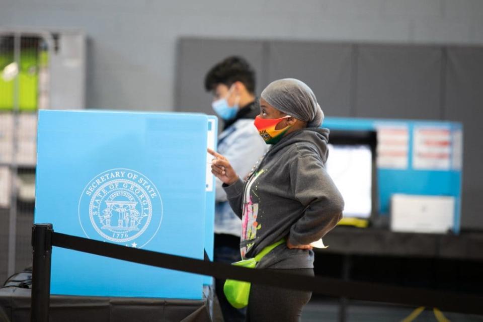 A Gwinnett county voter casts a ballot at Lucky Shoals Park polling station on November 3, 2020 in Norcross, Georgia. After a record-breaking early voting turnout, Americans head to the polls on the last day to cast their vote for incumbent U.S. President Donald Trump or Democratic nominee Joe Biden in the 2020 presidential election. (Photo by Jessica McGowan/Getty Images)