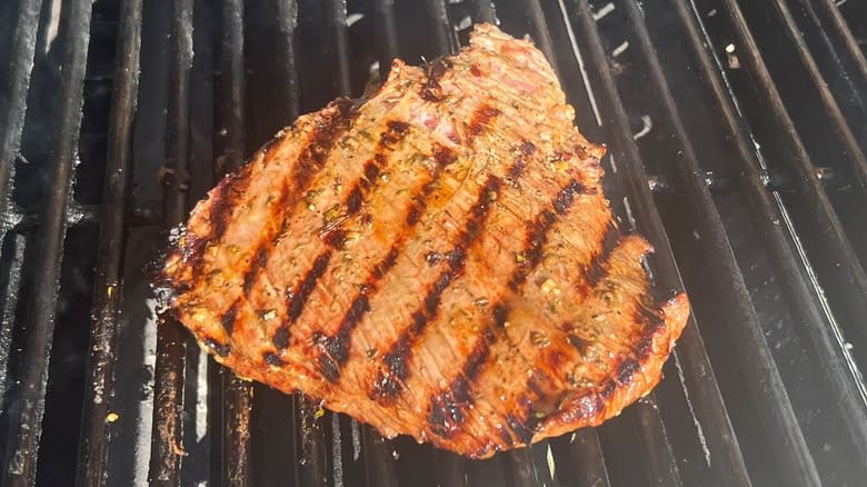 steak grilling on second side