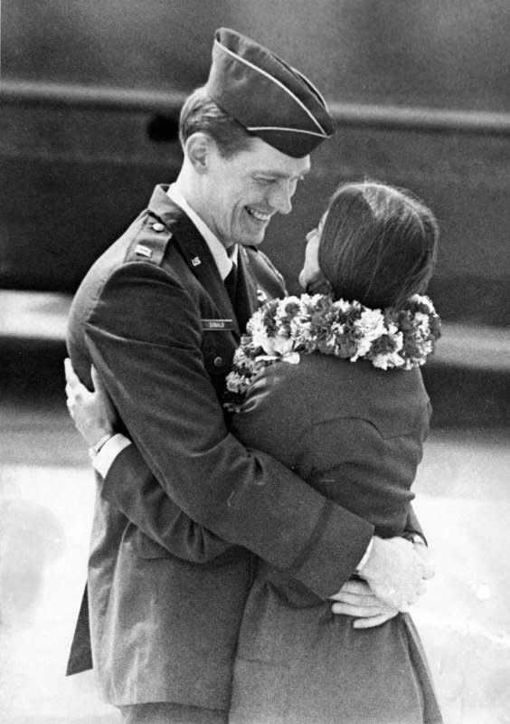 Capt. Myron L. Donald looks smilingly at this wife on March 17, 1973, at March Air Force base in California, two months after President Richard Nixon called for a halt to U.S. military offensives in Vietnam. Donald had been held by the North Vietnamese for over five years as a prisoner of war. UPI File Photo