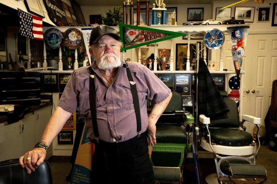 Donnie "DJ" Judd stands at his Barber Shop of over 30 years in Sharonville on Sept. 27. Judd cut the hair of Republican presidential candidate Vivek Ramaswamy when he was a child. Ramaswamy grew up in Cincinnati.