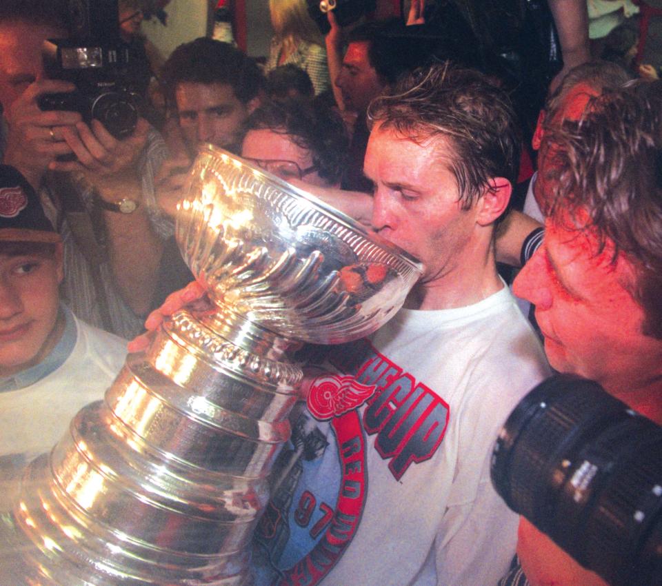 Defenseman Vladimir Konstantinov sipped champagne from a giant silver cup during the Red Wings’ dressing room celebration in 1997.