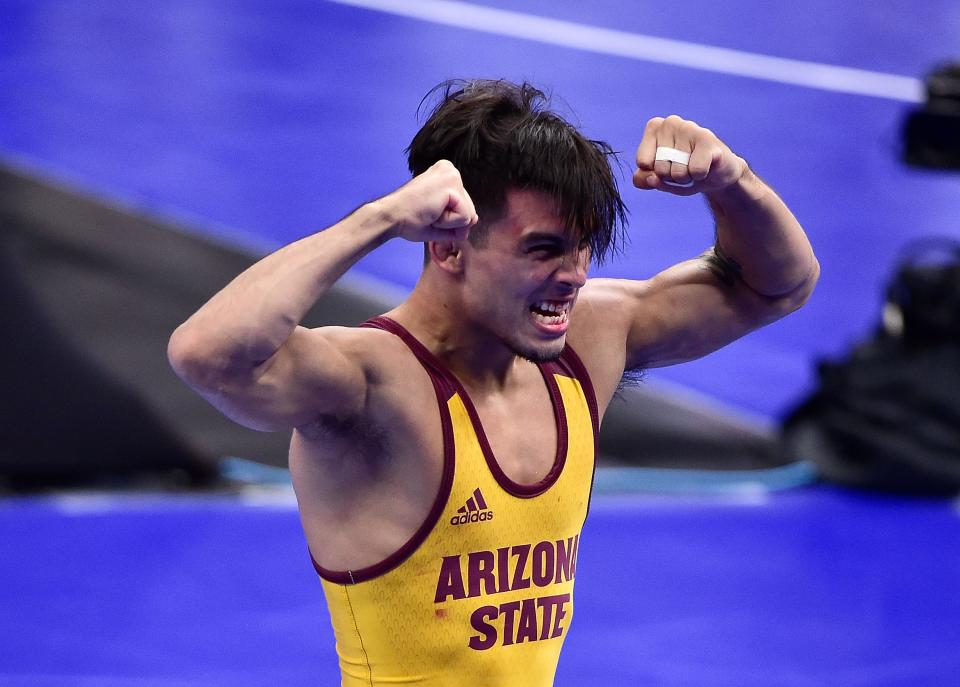 Arizona Sun Devils wrestler Brandon Courtney celebrates after defeating Utah Valley Wolverines wrestler Taylor LaMont in the 125 weight class during the semifinals of the 2021 NCAA Division I Wrestling Championships