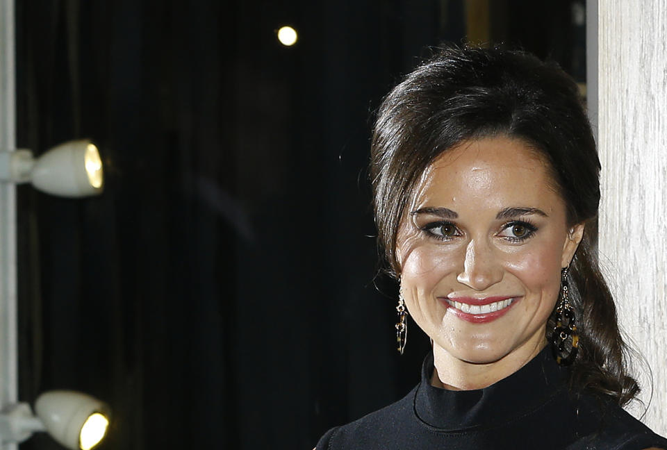 Pippa Middleton, sister to the Duchess of Cambridge, formerly known as Kate Middleton, poses for the media as she arrives at a bookshop to promote her new book "Celebrate: A Year of British festivities for families and friends", in London Thursday, Oct. 25, 2012. (AP Photo/Kirsty Wigglesworth)