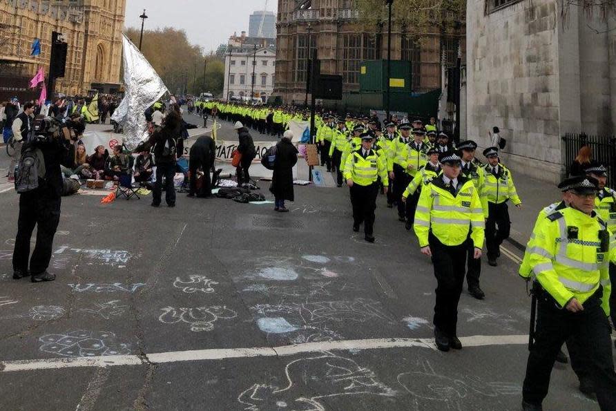 Police march in Parliament Square. (Extinction Rebellion)