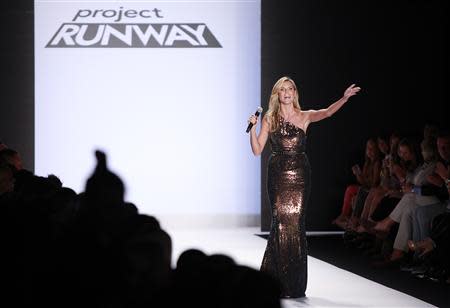 Project Runway judge Heidi Klum waves to the crowd following the Project Runway Spring 2014 collection show at New York Fashion Week September 6, 2013. REUTERS/Carlo Allegri