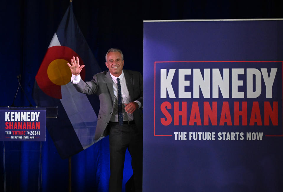 AURORA, CO - MAY  19: independent presidential candidate Robert F. Kennedy Jr. waves to the crowd as he exits the stage after speaking during a voter rally at The Hangar at Stanley Marketplace  in Aurora, Colorado on May 19, 2024.  Kennedy talked about his plans to 